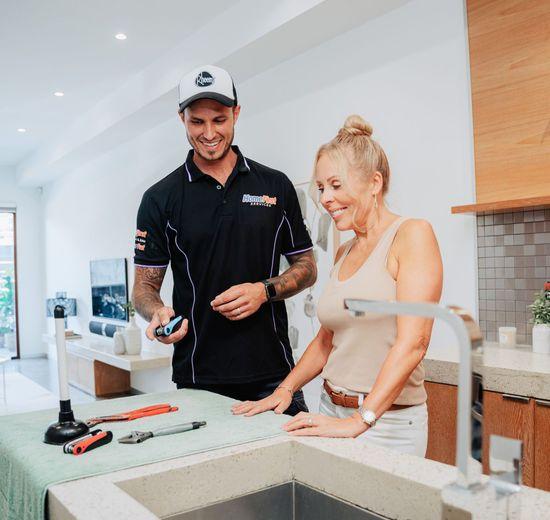 Tradie talking through a job with a customer